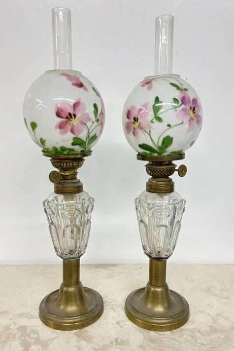 Pair of early oil lamps w/floral shades, measures 18" high to top of chimney, small chips on rims of: Pair of early oil lamps w/floral shades, measures 18" high to top of chimney, small chips on rims of globes, bases overall good condition