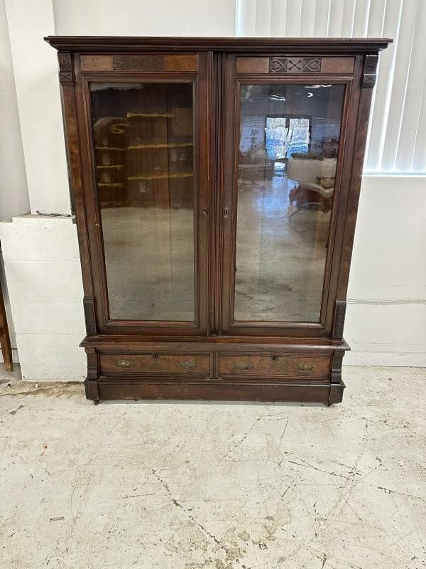 Victorian walnut 2 door bookcase in original finish w/2 drawers on bottom, right hand drawer has (1 of 3)