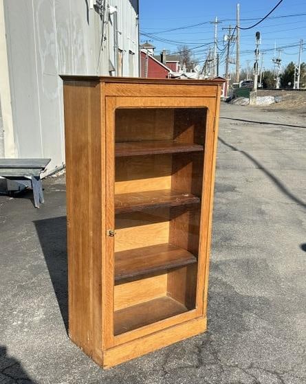 Ok 1 door bookcase, structurally sound, has 3 adjustable shelves, measures 26" W x 13.5" D x 49" H. (1 of 3)