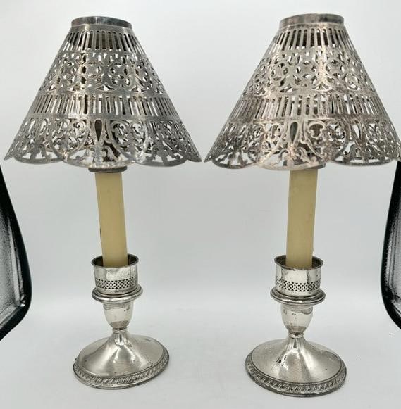 Pair weighted sterling CARTIER candlesticks, with pierced shades. Small crease on one base, doesn't (1 of 4)