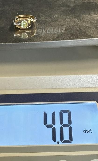 18K ladies ring with greenish color stone and diamond on side, weighs 4.8 dwt.  Size is 6. (1 of 5)