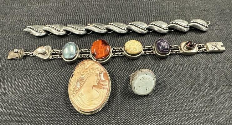 Estate sterling lot of jewelry, to include (2) bracelets ( one is TAXCO Mexican ), ring, and cameo. (1 of 4)