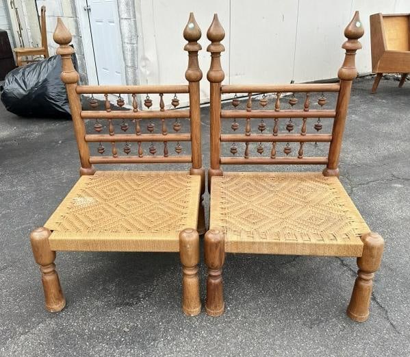 Pair of Indian low chairs with acorn shaped beads on back(1 missing), rush seats, the backs measure: Pair of Indian low chairs with acorn shaped beads on back(1 missing), rush seats, the backs measure 37" H.