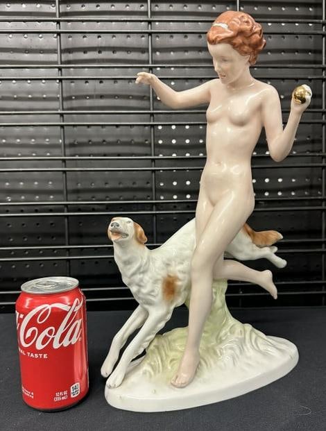 1930's porcelain figurine Nude Woman with dog, ball in her hand, fine estate condition. From: 1930's porcelain figurine Nude Woman with dog, ball in her hand, fine estate condition. From Chester, N.Y. estate. Measures 15" high. ( marked 717 29 ) on base as pictured. Possibly Royal Dux (?).