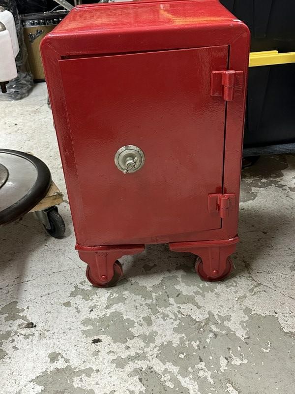 Antique cast iron small safe ( painted red ), was used in family game room as decorative object, (1 of 4)