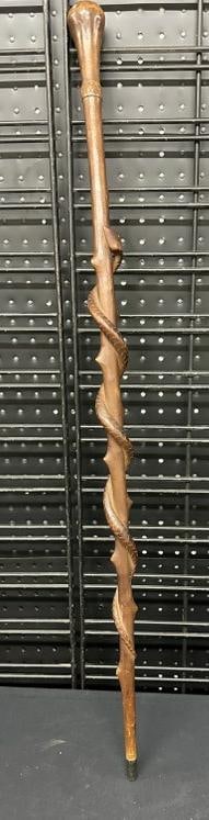 Folkart carved cane with snake going up the cane, origin unknown, from estate in the Hudson Valley.: Folkart carved cane with snake going up the cane, origin unknown, from estate in the Hudson Valley. Measures 36.5" top to bottom, very nice estate condition.