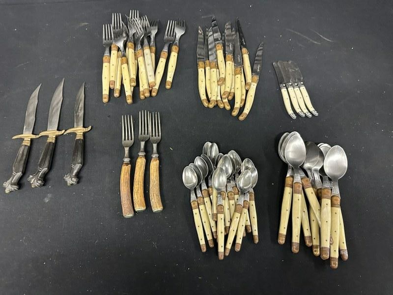 Estate lot of flatware, most made in FRANCE, some unknown. Includes (10) large INOX spoons, (16): Estate lot of flatware, most made in FRANCE, some unknown. Includes (10) large INOX spoons, (16) INOX small spoons, (4) LAGUIOLE butter knives, (12) JEAN DUBOST LAGUIOLE knives, (12) INOX large forks,