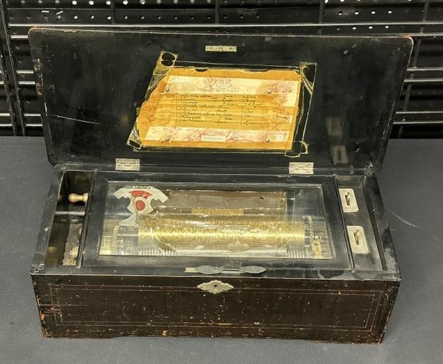 Wonderful rosewood inlaid Continental music box, working order, from fine NYC estate, some wear: Wonderful rosewood inlaid Continental music box, working order, from fine NYC estate, some wear spots to finish on sides, top is in very nice condtion with inlay. Measures 17" x 8" x 6" high.