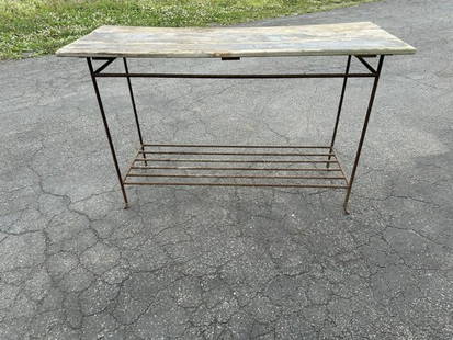 Iron base wood top console table, nice worn and rusted finish, was used on back porch, measures 48": Iron base wood top console table, nice worn and rusted finish, was used on back porch, measures 48" w x 18" deep x 30" hihg.