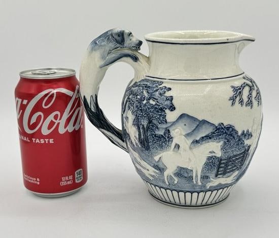 Early ceramic decorated blue & white pitcher, has figural dog handle, and raised figures & scenes on (1 of 7)
