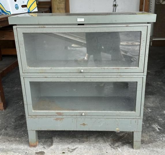 Metal 2 door stacking bookcase, in good condition, from local estate, measures 37 1/2" H X 35" W X: Metal 2 door stacking bookcase, in good condition, from local estate, measures 37 1/2" H X 35" W X 13 1/4" D