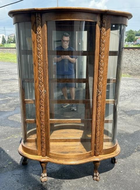 Contemporary carved oak curved glass china closet w/mirror back, measures 63 3/4" H X 45 1/2" W X 17 (1 of 3)