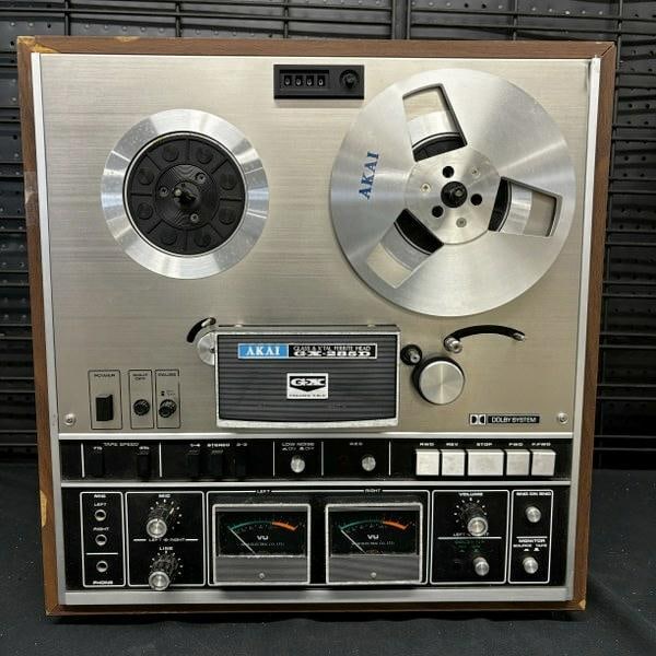 Vintage audio Akai GX-285D reel to reel tape deck. Serial number 70918-02159. Unit has been plugged: Vintage audio Akai GX-285D reel to reel tape deck. Serial number 70918-02159. Unit has been plugged in and powers up, but has not been tested. Veneer is being held in place with scotch tape on left si