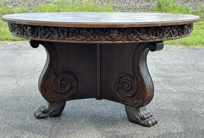 Wonderful circa 1910 carved oak pedestal dining table with cleaw feet, carved apron with faces, nice