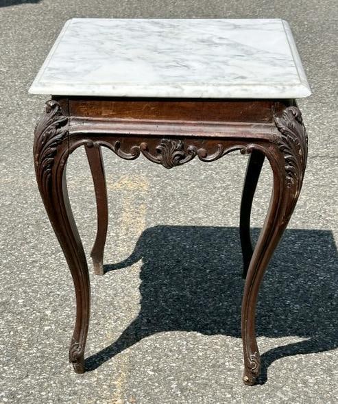 Small carved French style marble top stand, nice estate condition. Measures 21" high x 18" wide x (1 of 1)