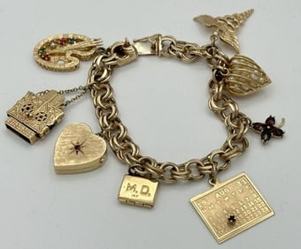 14k charm bracelet with (8) 14k charms, includes paint pallet with 5 stones, Judaic arc that opens,