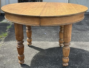 Circa 1910 round oak dining table with (2) leaves, fine estate condition, measures 44" across the