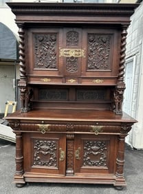 Monumental circa 1910 oak heavily carved sideboard, with full winged Griffins, original finish, in
