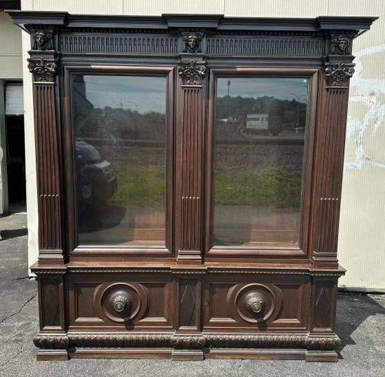 Wonderful mahogany circa 1910 oversized double door carved bookcase, with (2) doors on base, haeads (1 of 7)