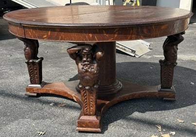 Fabulous circa 1910 round oak table with (4) male mythilogical figures on base, original finish, has