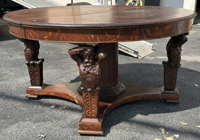Fabulous circa 1910 round oak table with (4) male mythilogical figures on base, original finish, has (1 of 10)