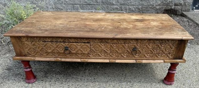 Indonesian 2 drawer coffee table, with carvings on the front, hardwood, structurally sound, from