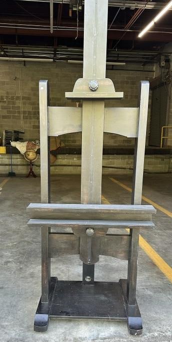 Large contemporary easel, was use in local estate with falt screen TV on it, measures 90.5" H X: Large contemporary easel, was use in local estate with falt screen TV on it, measures 90.5" H X 30.75" W X 28.5" D, black finish, good condition.