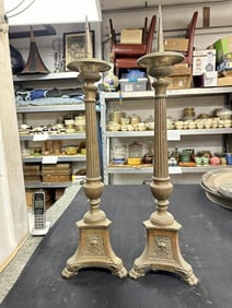 Pair brass 32" high candlesticks from Church, has 3 different details on base as pictured, with claw