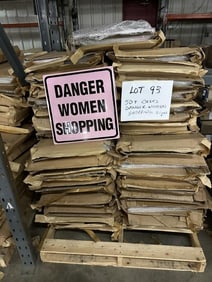 50+ cases of DANGER WOMEN SHOPPING tin embossed signs, (16" X 16")