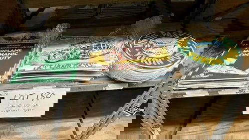 Over (60) enamel signs to include FLYING AVIATION PRODUCTS, ROUTE 66, GATEWAY TO THE YUKON……