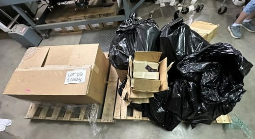 (2) pallets of thousands of magnet faces, with no magnet backs….