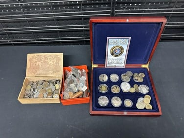 Misc. foreign coins and Elvis Presley commemorative coins, just as we found them, good lot for