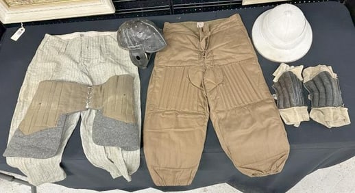 Early sports related lot to include leather helmet, quilted football pants that look like they were