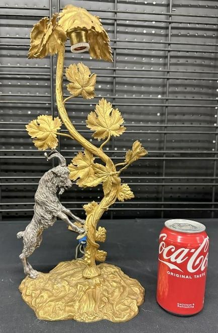 Wonderful gilt bronze table lamp with ram leaning on tree, the ram is silvercoated, has European: Wonderful gilt bronze table lamp with ram leaning on tree, the ram is silvercoated, has European style plug, very nice condition, lamp measures 16" high.
