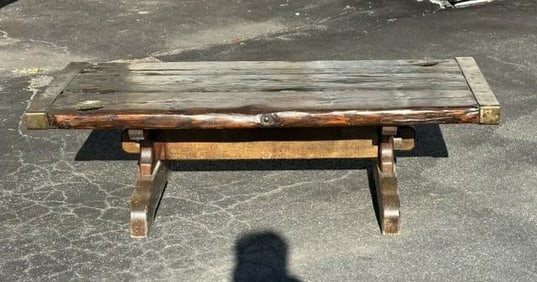 Thick pine country coffee table with iron strips on end, used at Mohonk weekenders home, has wear to