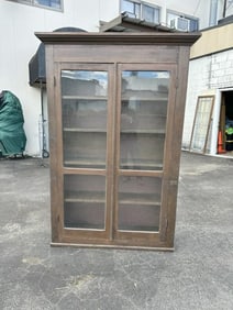 2 Door country bookcase with dark stain, has 4 shelves, measures 50" W x 12" D x 80" H.