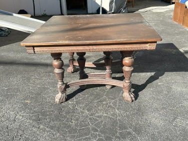 Circa 1910 square oak table w/claw feet, wear to the finish, structurally sound, comes with rack of