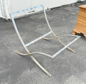 Chrome mid century chair frame, light surface rust throughout, measures 29.5" W x 32" D x 28" H.