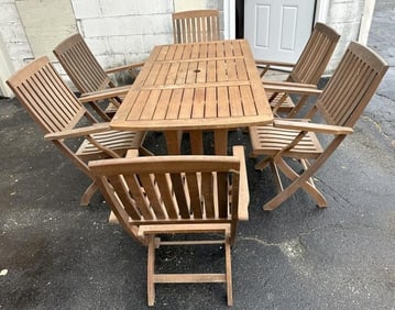 Nice teak table with 6 folding slat back and seat armchairs, was used in a indoor sunroom, table