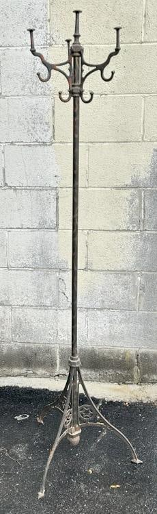 Circa 1900 brass and iron coat rack ,measures 65" H, nice old patina, has stars on base. (1 of 4)