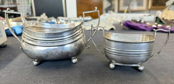 (2) early sugar bowls, one larger than the other, both have ball feet, they measure 7.75" & 6"