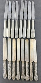 (2) sets of (8) sterling handle dinner knives, the fancy set has monograms, weight is (8) troy