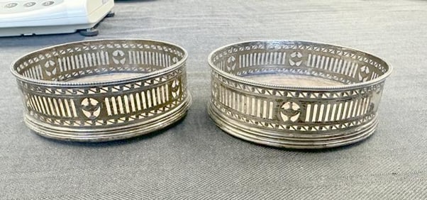 Pr. English sterling Georgian wine sliders, hallmarked as pictured, measure 4.5" across, (one small