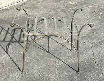 Decorative iron stool, no cushion, measures 27" W x 20" D and seat is 16" H.