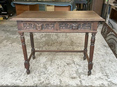 Circa 1910 oak 2 drawer table with carved lion heads on the drawers, structurally sound, nice old