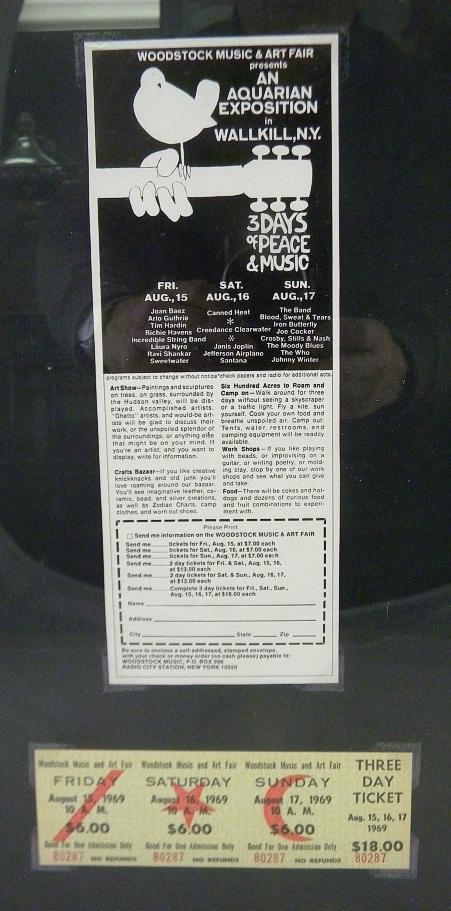 1969 Woodstock Music Festival framed display with u: 1969 Woodstock Music Festival framed display with unused 3 day ticket 7 Walkill, N.Y. advertisement.