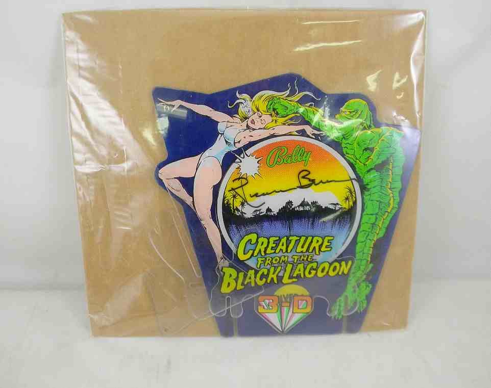 Ricou Browning Signed Creature From The Black Lago: Actor Ricou Browning Signed Creature From The Black Lagoon plexiglass pinball display & color photo.