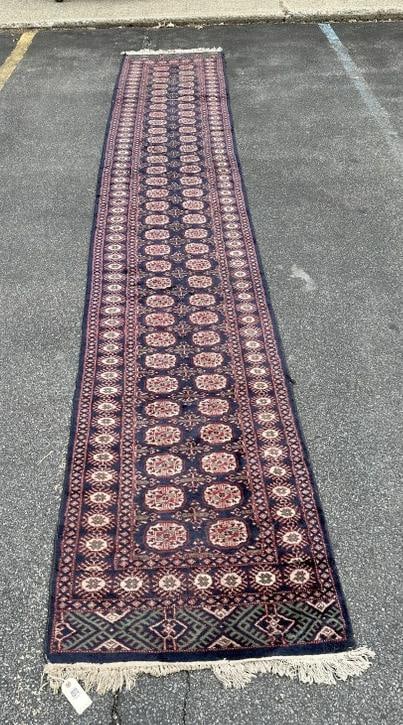 Estate handmade oriental runner, has a wear line, but overall nice condition, measures 185" x 32.5". (1 of 3)