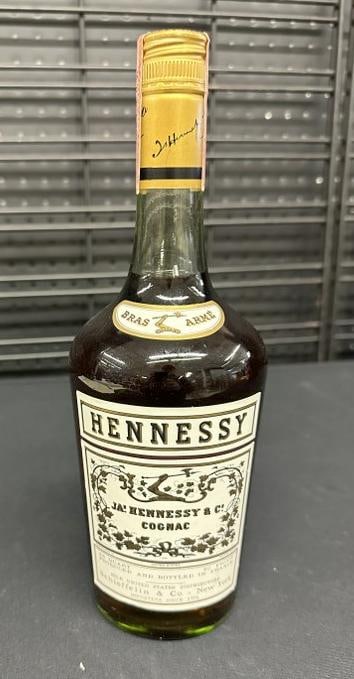 COGNAC HENNESSY BRAS ARME , 4/5 quart, labels are nice, has tax seal, 80 proof. AND a bottle of: COGNAC HENNESSY BRAS ARME , 4/5 quart, labels are nice, has tax seal, 80 proof. AND a bottle of vintage Bisquit, 750 Mil., 80 proof. All the alcohol and wine came from a local estate, they are JUST as