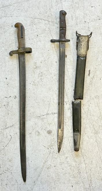(2) early bayonets, (1) with Sheath ( sheath is in 2 pieces ), and that is a REMINGTON WW I dated: (2) early bayonets, (1) with Sheath ( sheath is in 2 pieces ), and that is a REMINGTON WW I dated 1913, other one has brass handle, with no sheath, just as we found them.